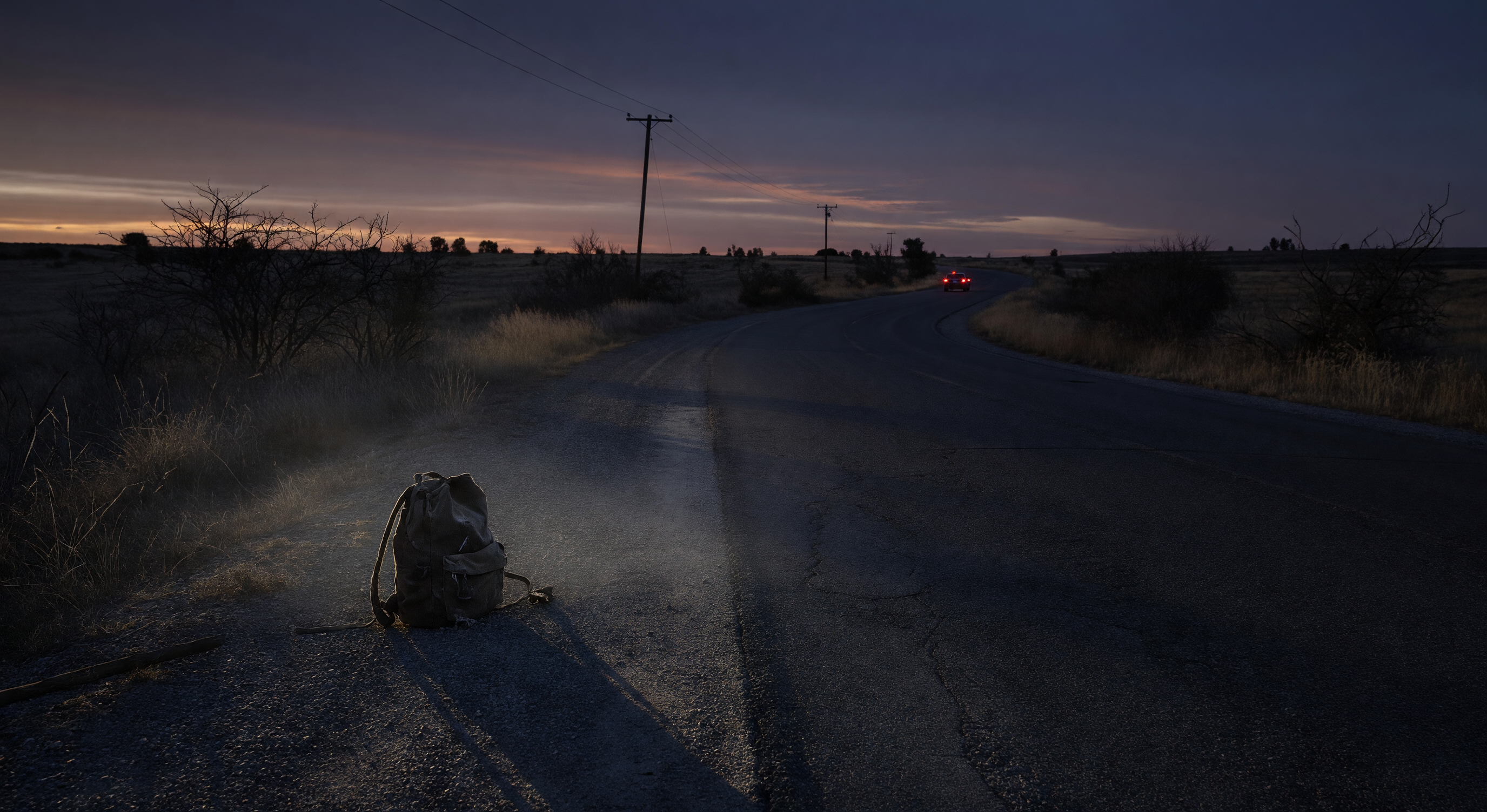 A rural highway stretching into the distance at twilight, red taillights fading around a bend, a single backpack on the roadside